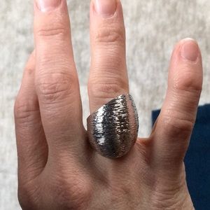 Silver tone statement ring.